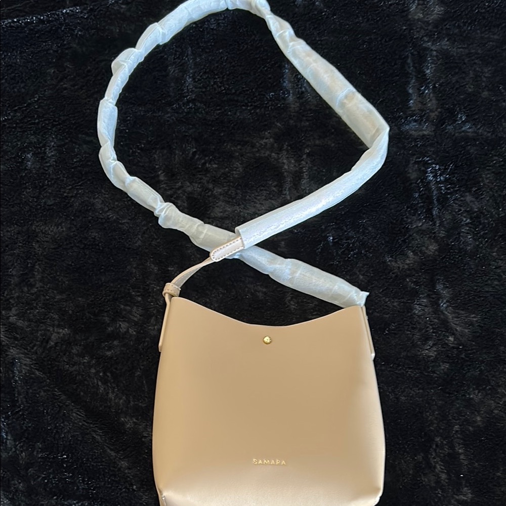 BRAND NEW crossbody tan vegan bag .